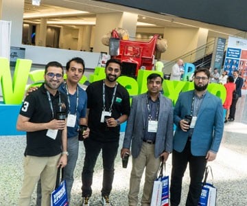 Attendees at WasteExpo holding reusable cups