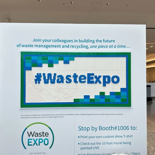 Attendees at WasteExpo holding reusable cups