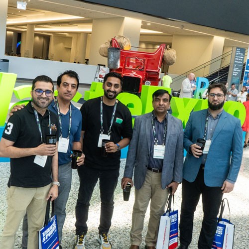 Attendees at WasteExpo holding reusable cups