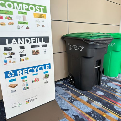 Attendees at WasteExpo holding reusable cups
