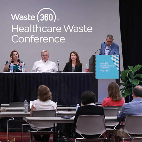 Panel of 3 speakers with a moderator at the podium conversing onstage at the Healthcare Waste Conference