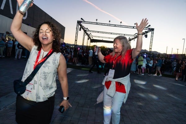 2 women dancing at the WasteExpo Welcome Reception