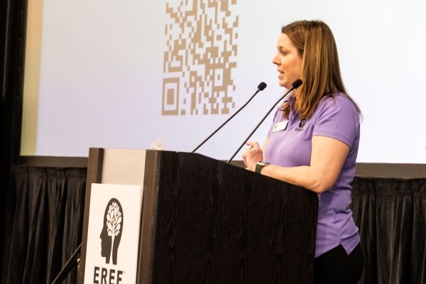 Speaker presenting at EREF auction