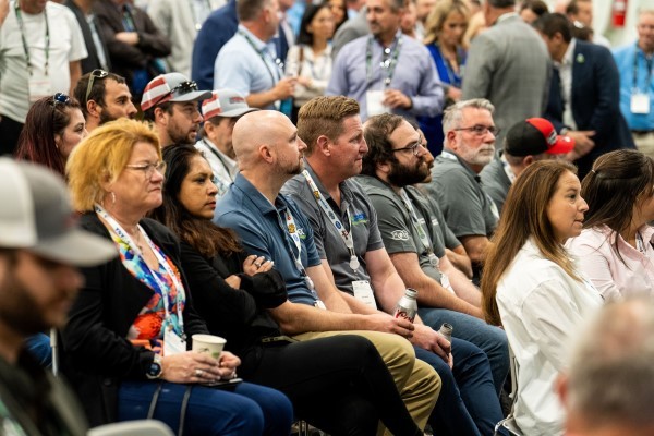 Group of attendees sitting down at the EREF Auction