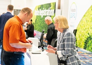 Attendees walking the WasteExpo show floor